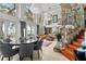 Open-concept living area with high ceilings, large windows, and stone accents at 17201 Magnolia Island Blvd, Clermont, FL 34711