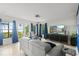 Bright living room with tile floors, stylish couch and views of the exterior at 17201 Magnolia Island Blvd, Clermont, FL 34711