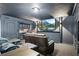 Entertainment space with a wet bar, large screen TV, and comfortable seating perfect for movies or gaming at 17201 Magnolia Island Blvd, Clermont, FL 34711