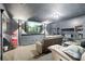 Cozy home theater with large screen, recliner seating, and a classic popcorn machine for the ultimate movie experience at 17201 Magnolia Island Blvd, Clermont, FL 34711
