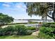 Inviting swimming pool with views of the lake and lush landscaping at 17201 Magnolia Island Blvd, Clermont, FL 34711