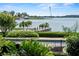 Breathtaking lake view features a private dock, lush greenery, and blue waters at 17201 Magnolia Island Blvd, Clermont, FL 34711