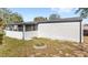 Backyard view of home with a screened in porch at 17529 Eve Dr, Montverde, FL 34756