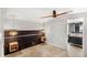 Bedroom featuring unique lighting, wood accent wall and bathroom access at 17529 Eve Dr, Montverde, FL 34756