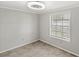 This bedroom features tile floors, trim and a window for natural light at 17529 Eve Dr, Montverde, FL 34756