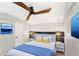Cozy bedroom featuring modern lighting, white bedding, and decorative wall art at 17529 Eve Dr, Montverde, FL 34756