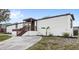 Charming single-story home with a cozy covered front porch and landscaped yard at 17529 Eve Dr, Montverde, FL 34756