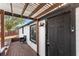 Inviting front porch with a stylish door and modern lighting fixture at 17529 Eve Dr, Montverde, FL 34756