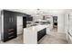 Modern kitchen with stainless steel appliances, a large island, and stylish backsplash at 17529 Eve Dr, Montverde, FL 34756