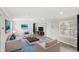 Cozy living room with a blue rug, light-toned furniture, and an accent wall at 17529 Eve Dr, Montverde, FL 34756