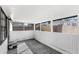 Enclosed patio with black and white patterned floor at 17529 Eve Dr, Montverde, FL 34756