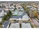 An aerial view showcases the home's location in a community with mature trees at 1854 Robin Rd, Orlando, FL 32814