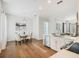 Cozy dining area adjacent to the kitchen featuring a chandelier and seating for four, with hardwood floors at 1854 Robin Rd, Orlando, FL 32814