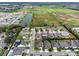 Bird's-eye view of a residential community with a pond and verdant landscape at 1938 Filly Trl, Oviedo, FL 32765