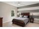 Bedroom with a queen bed, ceiling fan and a window overlooking the backyard at 1938 Filly Trl, Oviedo, FL 32765