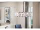 Elegant dining area featuring a modern crystal chandelier and stylish decor at 1938 Filly Trl, Oviedo, FL 32765
