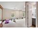 Bright workout room boasts mirrored wall, ample space for equipment, and a refreshing view at 1938 Filly Trl, Oviedo, FL 32765