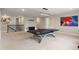 Spacious game room featuring a sleek ping pong table, neutral walls, and contemporary artwork at 1938 Filly Trl, Oviedo, FL 32765