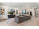 Spacious living room features a large sectional sofa, and stylish decor at 1938 Filly Trl, Oviedo, FL 32765