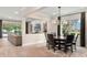 Open concept living and dining area featuring elegant decor, natural light, and hardwood floors at 1938 Filly Trl, Oviedo, FL 32765