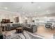 Open-concept living room with modern furnishings and bright, white lighting at 1938 Filly Trl, Oviedo, FL 32765