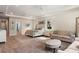 Bright main bedroom with dual ceiling fans, recessed lighting, and attached bath at 1938 Filly Trl, Oviedo, FL 32765