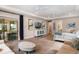 Bright main bedroom with dual ceiling fans, slider doors, and seating area at 1938 Filly Trl, Oviedo, FL 32765
