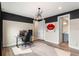 Office featuring wood floors, an accent wall, modern lighting, and an ensuite bath at 1938 Filly Trl, Oviedo, FL 32765