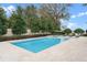 Stunning backyard with a sparkling pool, spa, and lush landscaping at 1938 Filly Trl, Oviedo, FL 32765