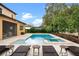 Beautiful backyard pool and spa are set among lush landscaping at 1938 Filly Trl, Oviedo, FL 32765