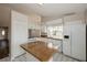 Well-lit kitchen features white cabinetry, ample counter space, and modern appliances at 210 Sonoma Valley Cir, Orlando, FL 32835