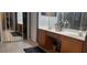 Dual sinks are featured in this well-lit bathroom with tile floors and a walk-in closet at 2133 Korat Ln, Maitland, FL 32751