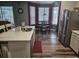 Well-lit kitchen with stainless steel appliances, a stylish island, and dining area with large windows at 2133 Korat Ln, Maitland, FL 32751