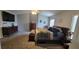 Carpeted main bedroom featuring ceiling fan, dresser and TV for maximum comfort and convenience at 2133 Korat Ln, Maitland, FL 32751