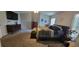 A spacious bedroom featuring a king-size bed, soft carpet, and large windows for ample natural light at 2133 Korat Ln, Maitland, FL 32751