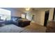 A large primary bedroom showcasing neutral walls, plush carpet, and a connected bathroom at 2133 Korat Ln, Maitland, FL 32751
