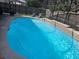 Screened in pool with seating and landscaped fenced yard at 2133 Korat Ln, Maitland, FL 32751