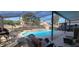 Screened-in pool featuring a cozy patio and deck-chairs for relaxation and entertainment at 2133 Korat Ln, Maitland, FL 32751