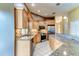 Well-appointed kitchen featuring updated appliances, granite countertops, and ample cabinet space at 2439 Teton Stone Run, Orlando, FL 32828