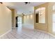 Expansive living area boasting tile floors, a ceiling fan, and sliding glass doors at 2439 Teton Stone Run, Orlando, FL 32828