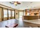 Open floor plan with kitchen, living and dining area leading out to screened-in pool at 2439 Teton Stone Run, Orlando, FL 32828
