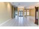 Open-concept living room with tile flooring, high ceilings, and a seamless flow for entertaining at 2439 Teton Stone Run, Orlando, FL 32828