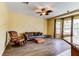Bright living room with hardwood floors and large windows offering plenty of natural light at 2439 Teton Stone Run, Orlando, FL 32828