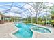 Screened in pool and spa offers a beautiful backyard escape with an outdoor kitchen and golf course views at 2439 Teton Stone Run, Orlando, FL 32828