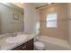 Bathroom showcasing a combination shower and tub with tile surround and modern vanity at 2447 Matterhorn Trl, Davenport, FL 33837