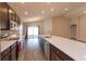 Gourmet kitchen featuring stainless steel appliances, a spacious island, and recessed lighting at 2447 Matterhorn Trl, Davenport, FL 33837