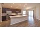 Bright kitchen showcasing a large island, stainless appliances, and plenty of storage at 2447 Matterhorn Trl, Davenport, FL 33837