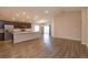 Open-concept living space featuring wood-look flooring, recessed lighting, and sliding glass doors at 2447 Matterhorn Trl, Davenport, FL 33837