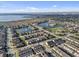 Community aerial shot with ponds and water features amid rows of meticulously arranged townhomes at 2682 Mead Ave, St Cloud, FL 34771