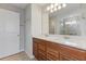 Bathroom featuring double sink vanity, generous countertop space, and a glass-enclosed shower at 2682 Mead Ave, St Cloud, FL 34771